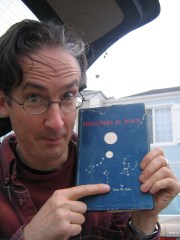 Mark Hosler holding a copy of Estus W. Pirkle's book Preachers in Space