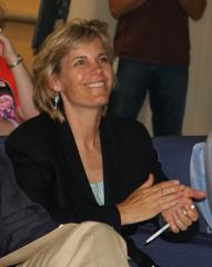 Sue Decker smiling and clapping in the audience at Yahoo! Hack Day