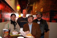 Drew Fleck, Bob Waldron, Todd Hanson and Justin Kruger at a restaurant table in Appleton, Wisconsin