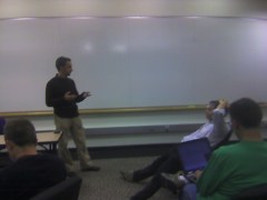 Pasha Sadri and Jon Udell talking with a small group in a Yahoo! meeting room