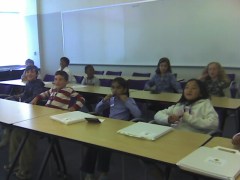 Kids sitting at classroom tables at Yahoo! on Kids Day